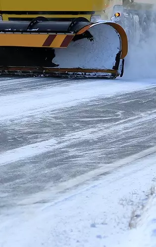 close up view of snowplough clearing snow